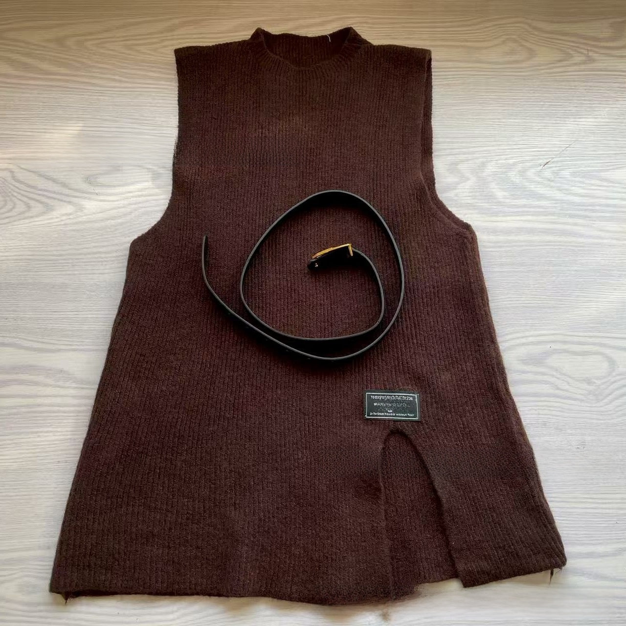 A two-piece loose knitted vest and shirt set for women